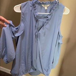 Light blue blouse. Drill neck, tying collar